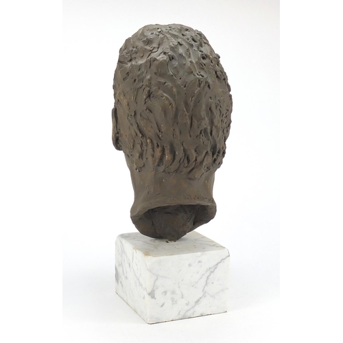 2081 - Modernist bust of a gentleman raised on a white marble base, 44cm high