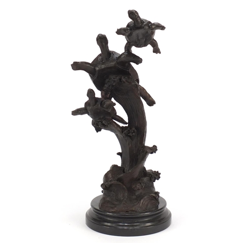 2160 - Patinated bronze sculpture of three sea turtles, raised on a circular marble base, 41cm high