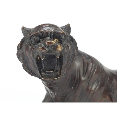 2131 - Large Japanese style patinated bronze tiger, 30.5cm in length