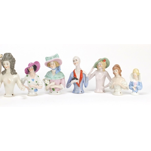 2151 - Eleven 19th century hand painted porcelain half pin dolls, the largest 11.5cm high