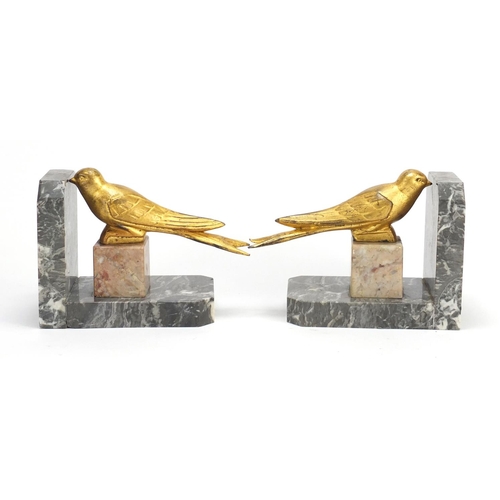 2111 - Pair of Art Deco marble and gilt bird design bookends, each 16.5cm high