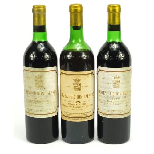 2098 - Three bottles of vintage Chateau Pichon Paulliac red wine comprising 1975 and 1976