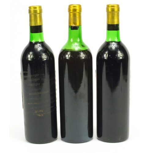 2098 - Three bottles of vintage Chateau Pichon Paulliac red wine comprising 1975 and 1976
