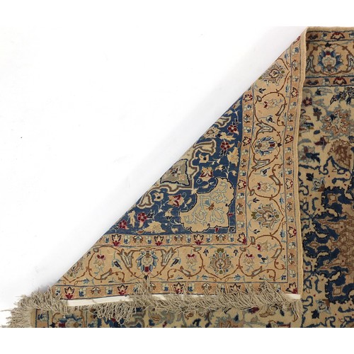 2006 - Persian blue and cream ground rug with all over floral design, 195cm x 118cm