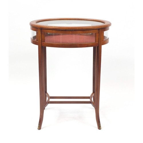 2016 - Oval inlaid mahogany bijouterie table with bevelled glass top, 76cm H x 59cm wide x 47cm D