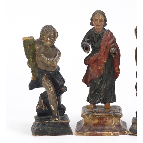 122 - Three 18th century polychrome painted carved wood figures 16.5cm high