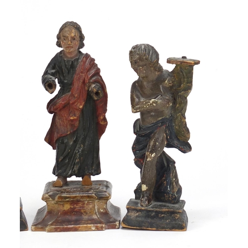 122 - Three 18th century polychrome painted carved wood figures 16.5cm high