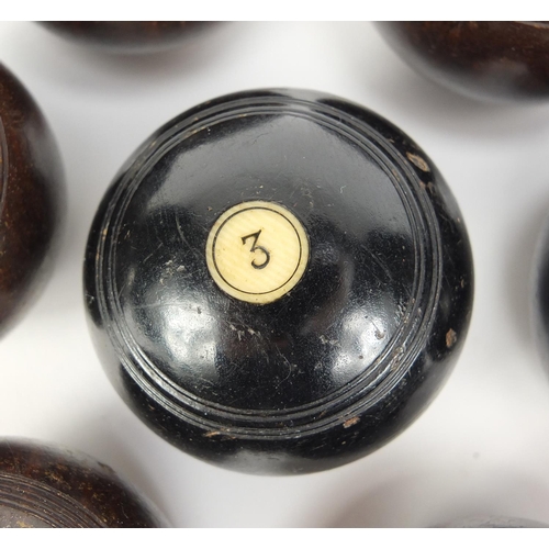 150 - Two sets of Victorian hardwood carpet bowls with ivory inlay, the largest approximately 5.5cm in dia... 