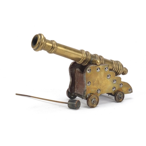 97 - Antique brass table cannon and carriage, 24.5cm in length