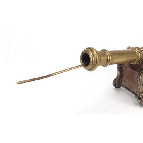 97 - Antique brass table cannon and carriage, 24.5cm in length