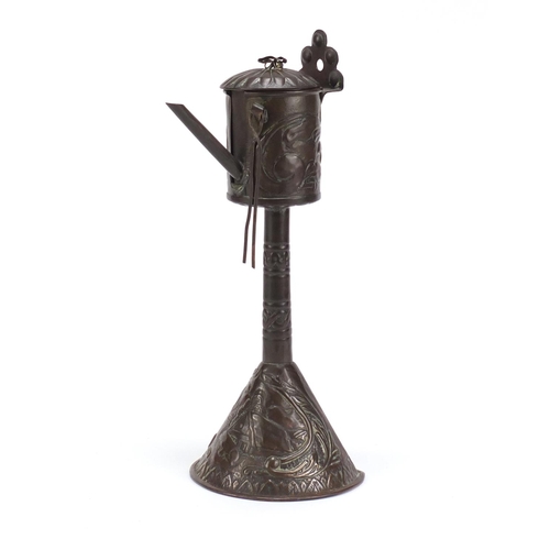 67 - 19th century Dutch? copper lace-maker's lamp embossed with a bear outside of a house, 28cm high