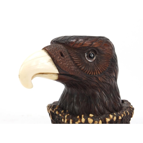 121 - Novelty carved horn eagle design desk inkwell with ivory beak and beaded eye, 9cm high