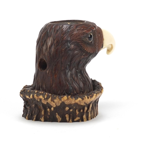 121 - Novelty carved horn eagle design desk inkwell with ivory beak and beaded eye, 9cm high