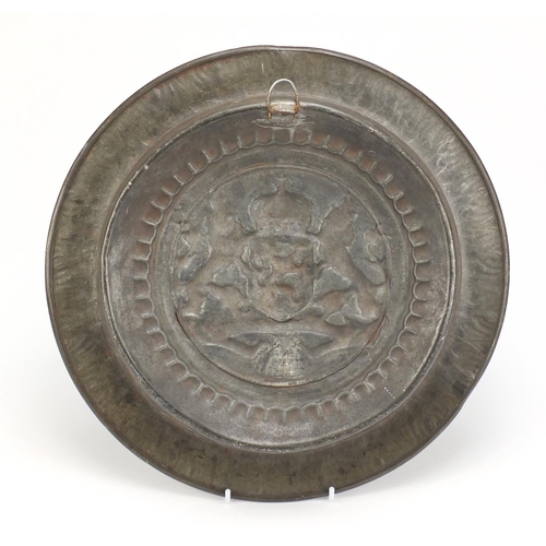 112 - Antique pewter wall plaque embossed with a coat of arms 34.5cm in diameter