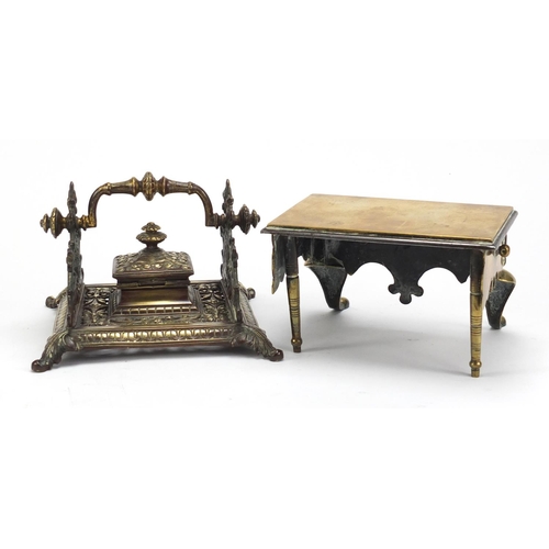 103 - Victorian brass inkstand and a miniature Georgian brass footman, the largest 17cm wide