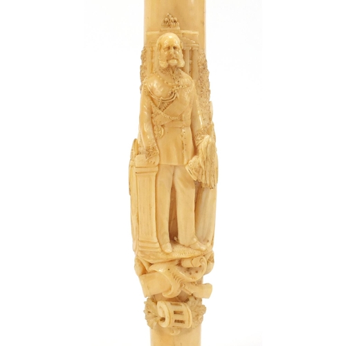 129 - Good 19th century ivory walking stick handle finely carved in relief with a soldier in military dres... 