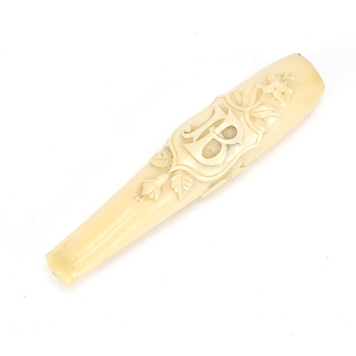 124 - Victorian carved ivory cigarette holder housed in a tooled leather velvet lined case, 11cm in length