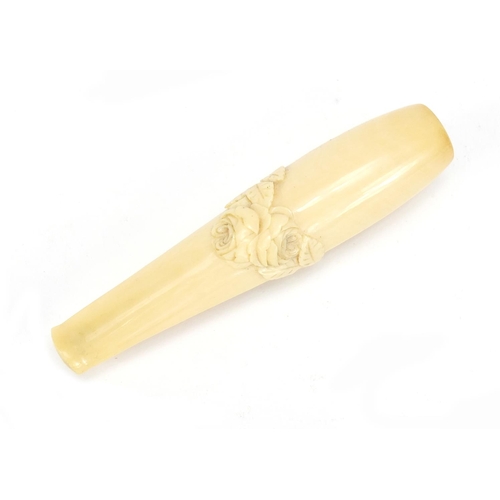 124 - Victorian carved ivory cigarette holder housed in a tooled leather velvet lined case, 11cm in length