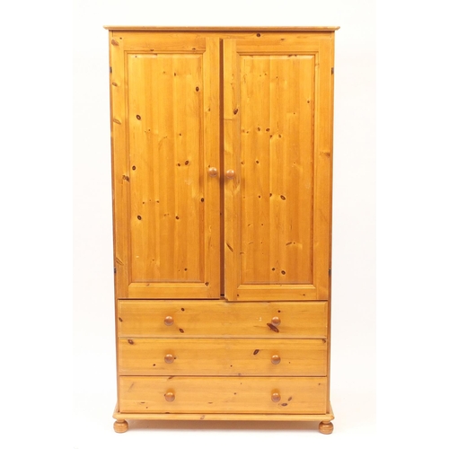 47 - Pine two door wardrobe fitted with three drawers to the base, 172cm H x 94cm W x 58cm D