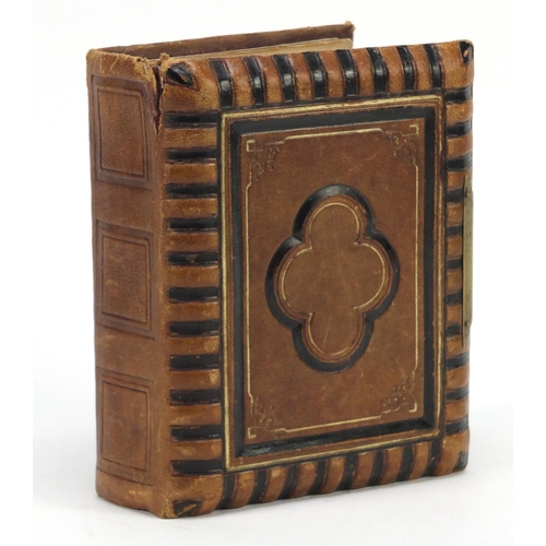 941 - Victorian black and white cabinet cards arranged in a tooled leather album