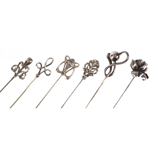 9 - Six Art Nouveau silver hat pins, various hallmarks, the largest 26.8cm in length
