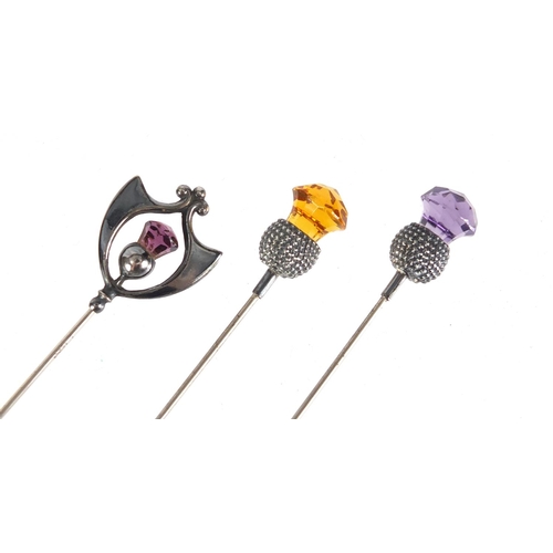 6 - Three Art Nouveau silver thistle design hat pins set with amethyst and citrine, one by Charles Horne... 