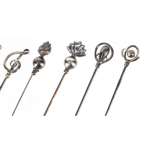 11 - Six silver hat pins including a pair by Charles Horner, the largest 17cm in length
