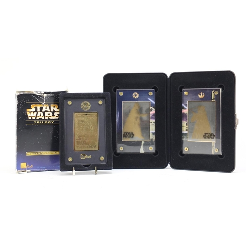 2464 - Star Wars 24ct gold collectors cards comprising A New Hope and Star Wars trilogy