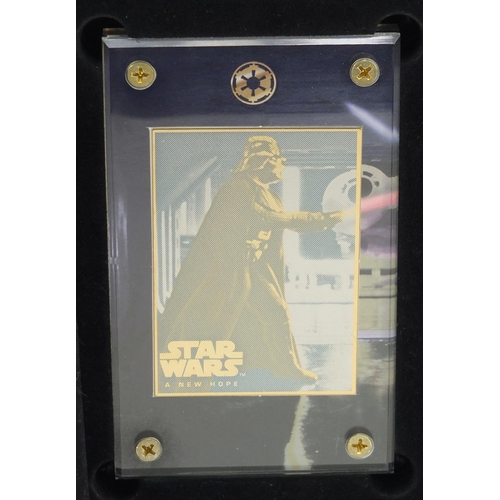 2464 - Star Wars 24ct gold collectors cards comprising A New Hope and Star Wars trilogy