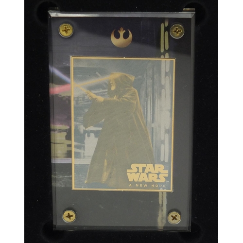 2464 - Star Wars 24ct gold collectors cards comprising A New Hope and Star Wars trilogy