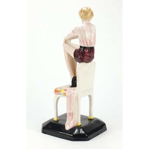 605 - Austrian Art Deco figurine of a girl seated on a chair by Goldscheider, modelled by Lorenzl factory ... 