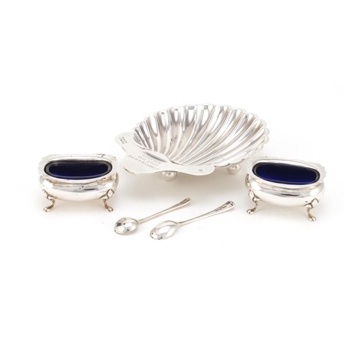 2461 - Silver shell shaped dish and a pair of silver open salts with blue glass liners, various hallmarks, ... 