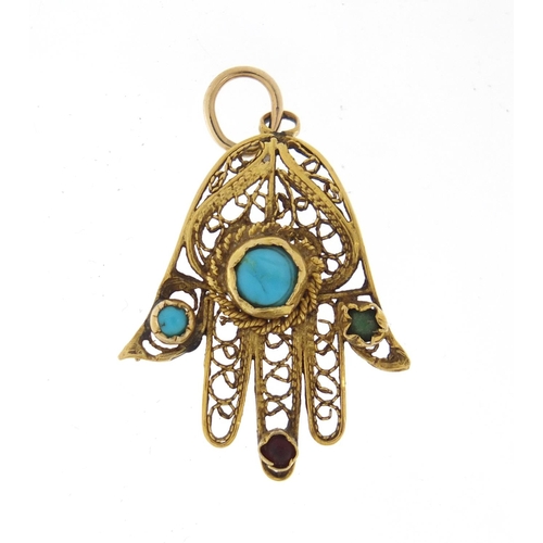 765 - Unmarked gold Hand of Fatima pendant set with semi precious stones including turquoise and garnet, 3... 