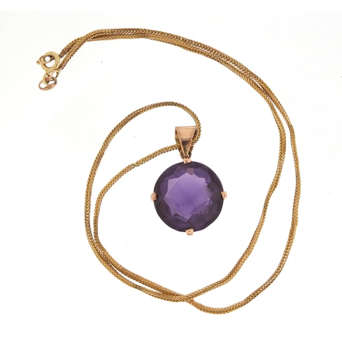 756 - Unmarked gold blue/purple stone pendant, possibly Alexandrite, on a 9ct gold necklace, 11.8g