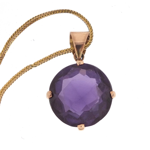 756 - Unmarked gold blue/purple stone pendant, possibly Alexandrite, on a 9ct gold necklace, 11.8g