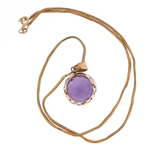 756 - Unmarked gold blue/purple stone pendant, possibly Alexandrite, on a 9ct gold necklace, 11.8g