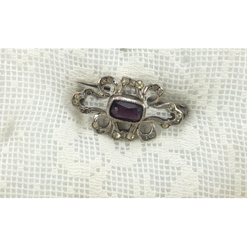 784 - Victorian and later garnet jewellery, comprising 
three brooches and two tie pins, housed in a mahog... 