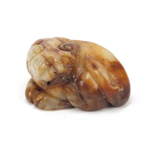 2460 - Chinese white and russet jade carving of a lion