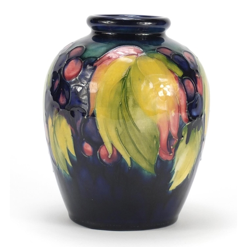 608 - Moorcroft pottery vase, hand painted in the leaf and berry pattern, painted and impressed marks to t... 