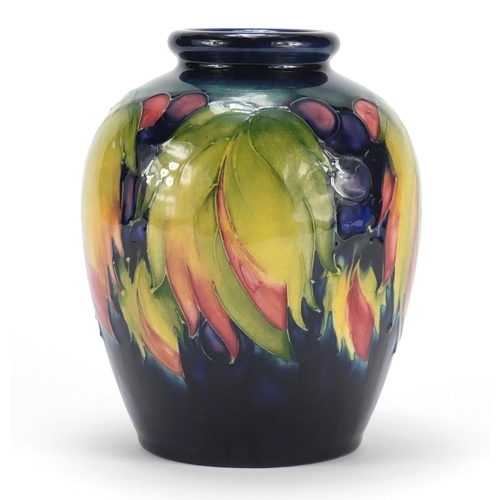 608 - Moorcroft pottery vase, hand painted in the leaf and berry pattern, painted and impressed marks to t... 