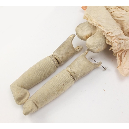 145 - Two 19th century dolls with composite limbs, wearing traditional dress