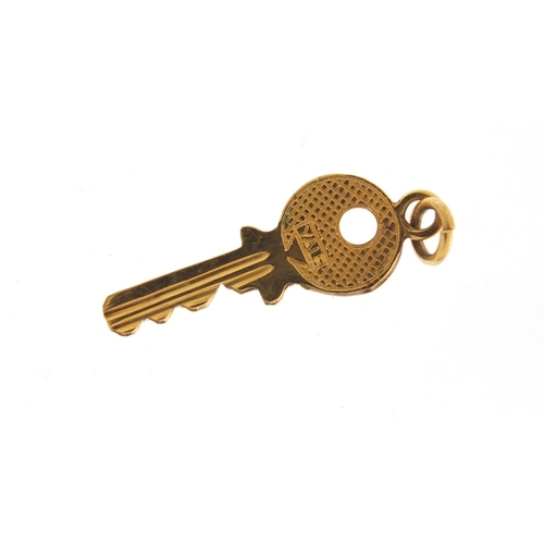 2584 - 9ct gold key charm, 2cm in length, 0.7g