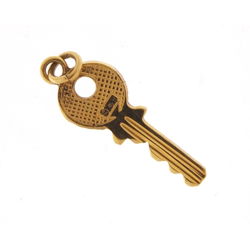 2584 - 9ct gold key charm, 2cm in length, 0.7g