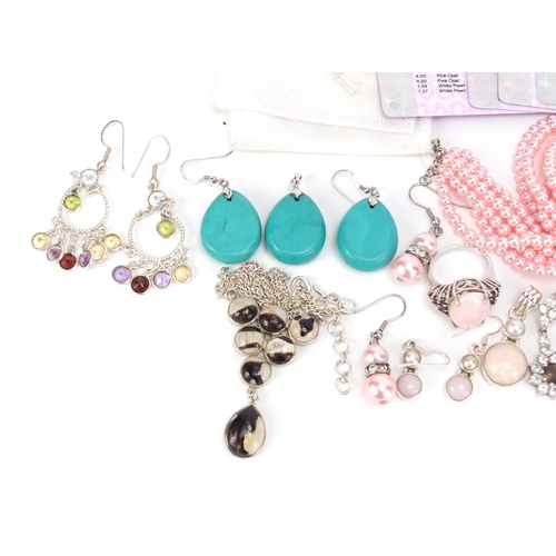 2585 - Silver semi precious stone jewellery with certificates including pink opal, turquoise and smokey qua... 