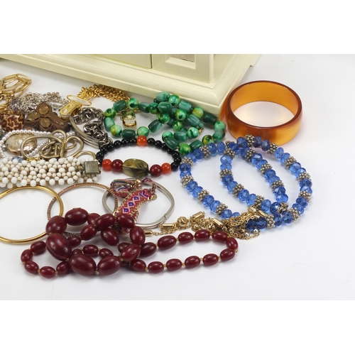 2627 - Costume jewellery including cameos, amber coloured beads, necklaces, bracelets, brooches, earrings a... 