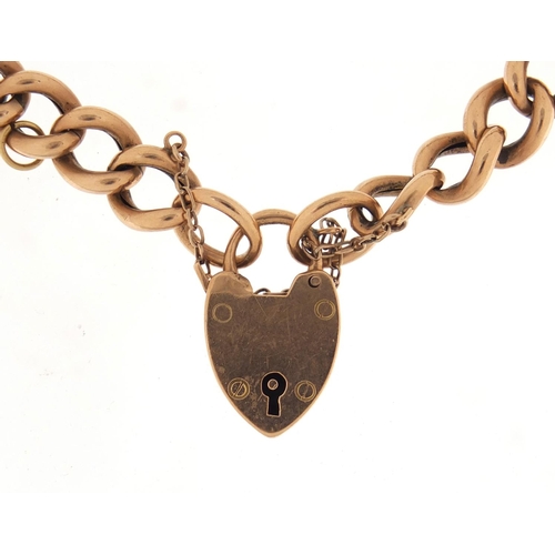2522 - 9ct gold bracelet with love heart padlock, 17.0g