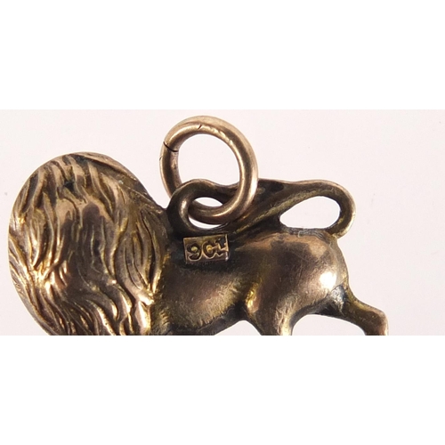 2569 - 9ct gold lion charm, 1.5cm in length, 1.0g