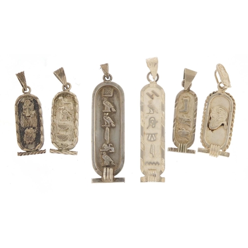 2587 - Six silver Egyptian hieroglyphic pendants, the largest 5cm in length, 23.6g