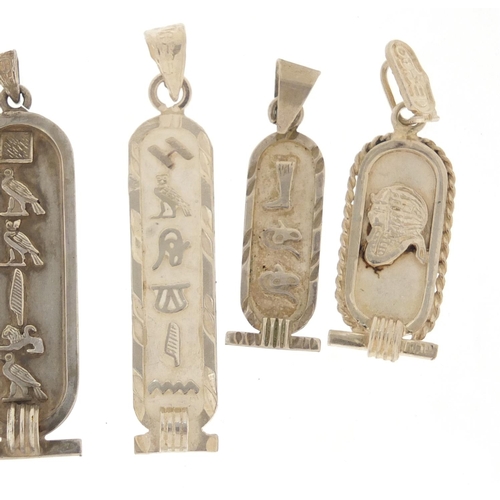 2587 - Six silver Egyptian hieroglyphic pendants, the largest 5cm in length, 23.6g