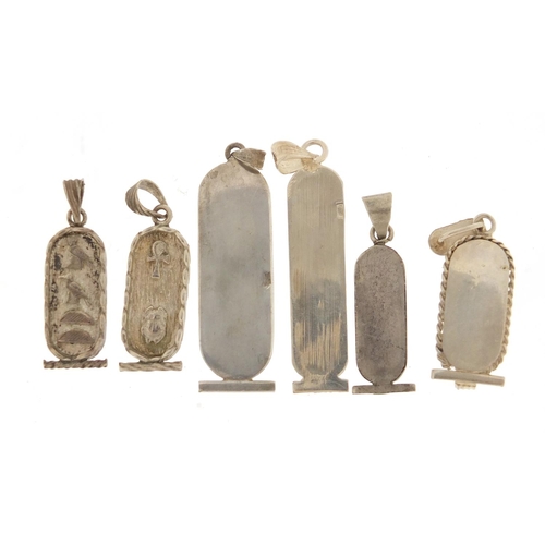 2587 - Six silver Egyptian hieroglyphic pendants, the largest 5cm in length, 23.6g